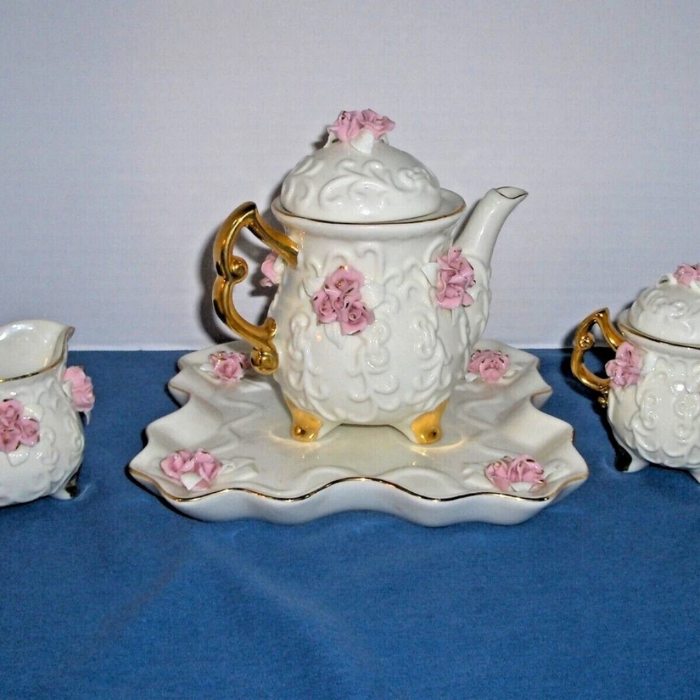 Elegant White and Pink Tea Set with Gold Accents